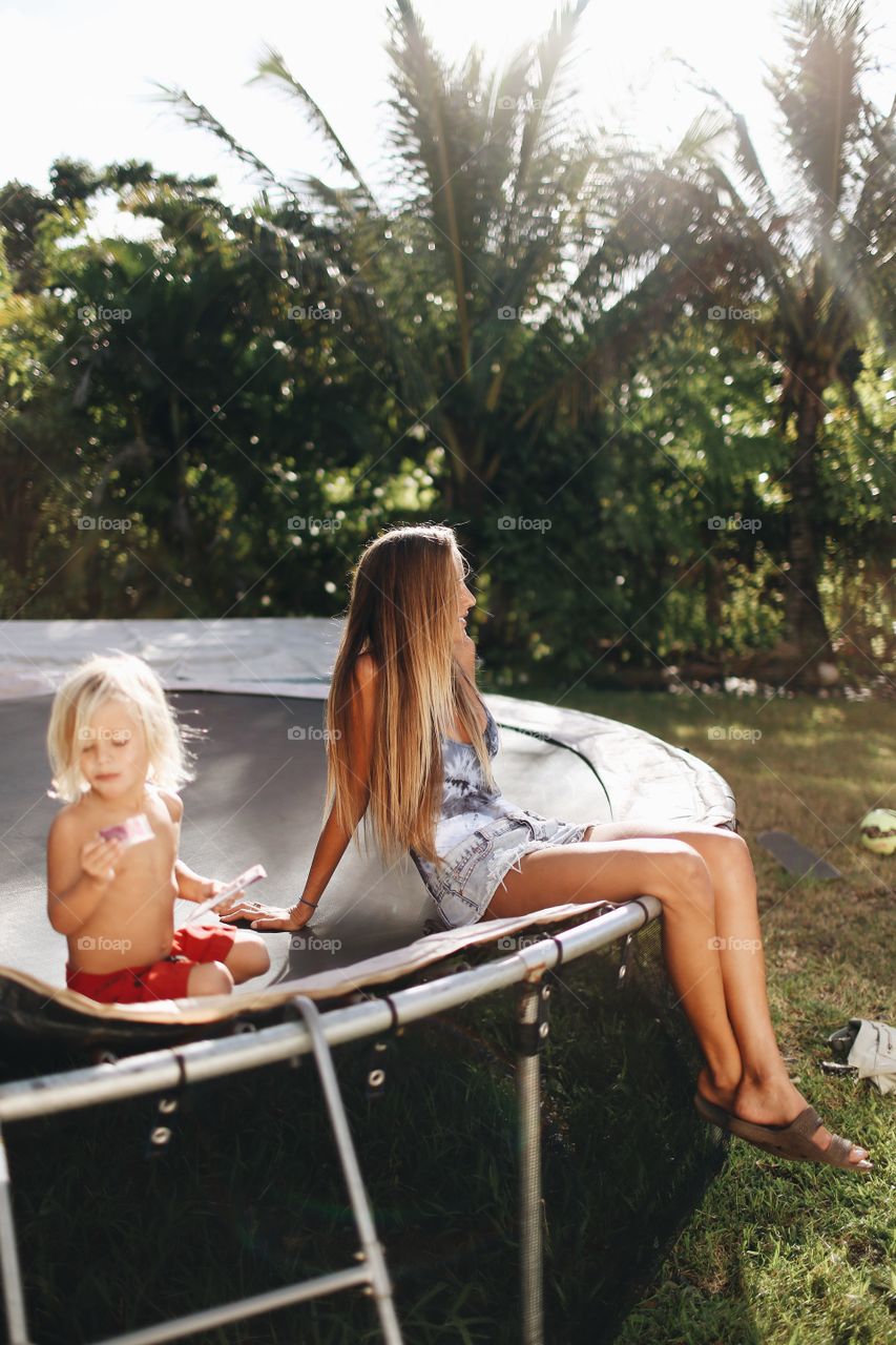 Mom and child relaxing on a hot summer day.