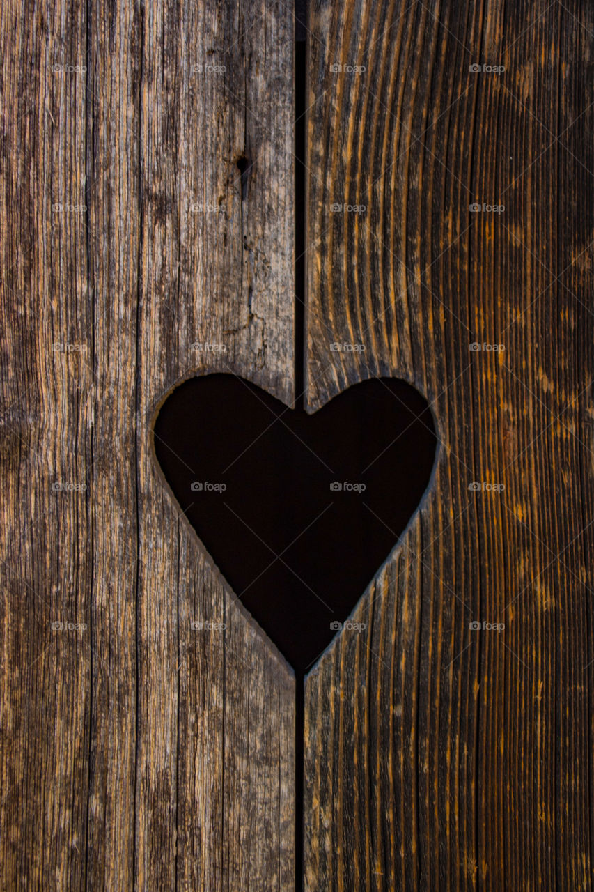 black heart cut out of wood