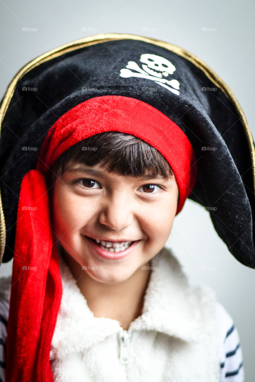 Cute happy little child dressed as a pirate