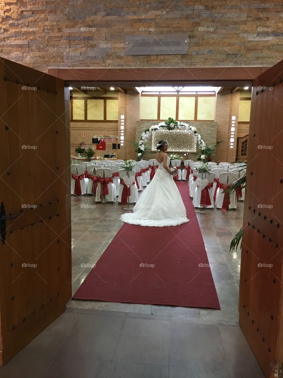 Wedding entrance to salon with model posing 
