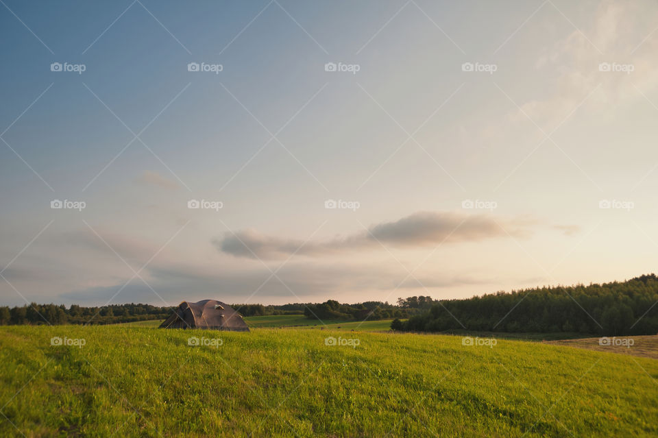 Summertime. Tent in countryside.