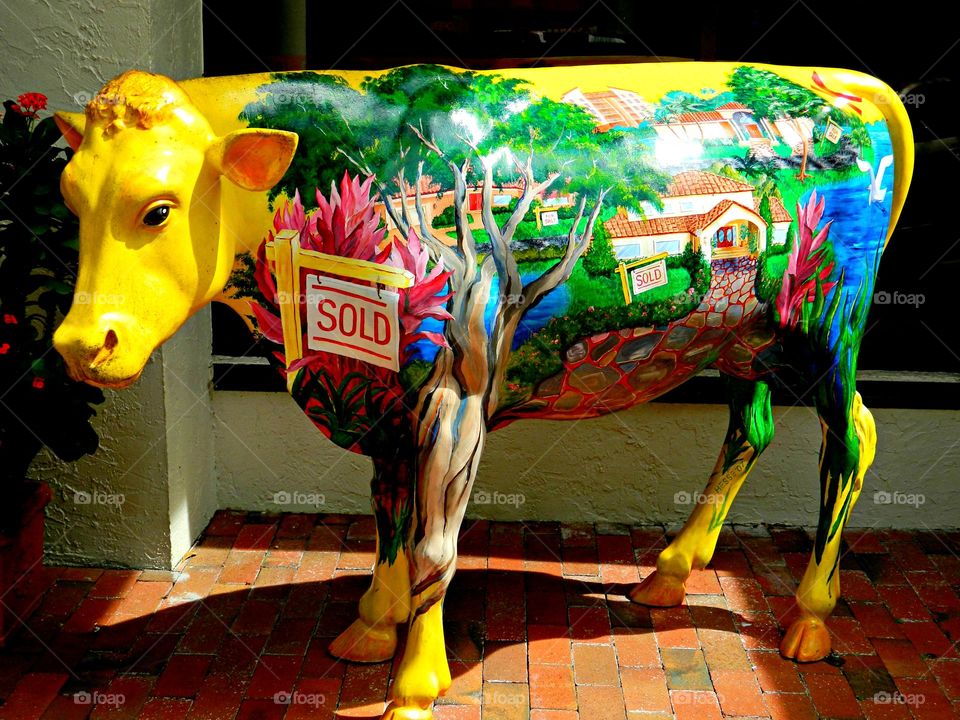 Colorful cow - Visual Art that can be found on the street. Visual Street art is essentially synonymous with public art as it encompasses a variety of mediums like painting, sculpture, and stained glass