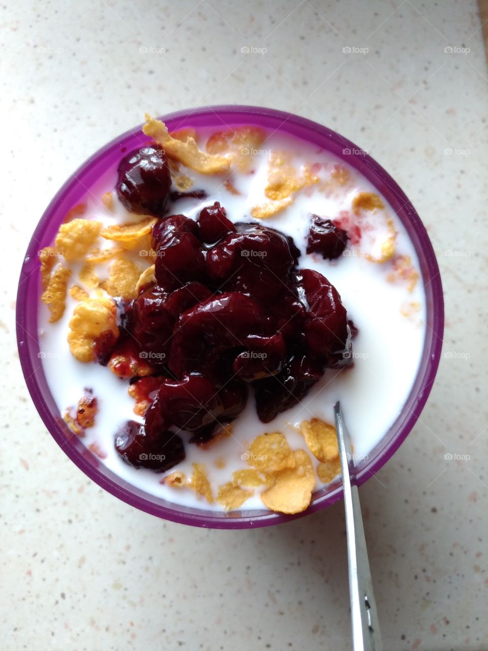 cornflakes with milk and candied cherries