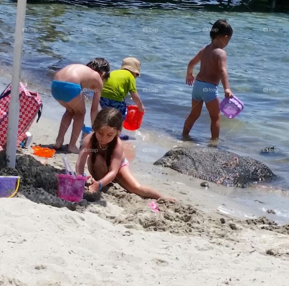 kids playing in the beach