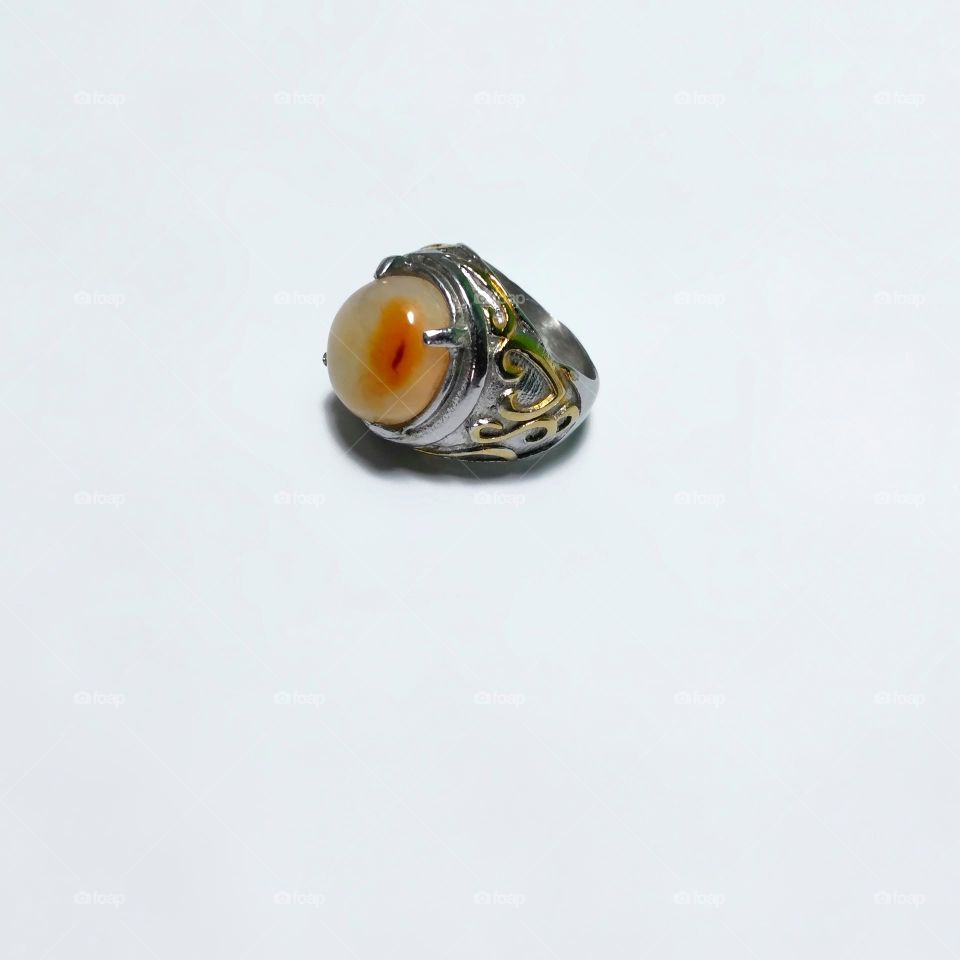 Beautiful agate ring on white background