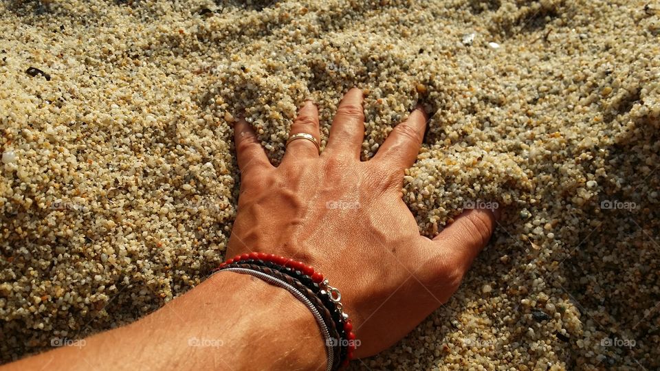 hand in the sand