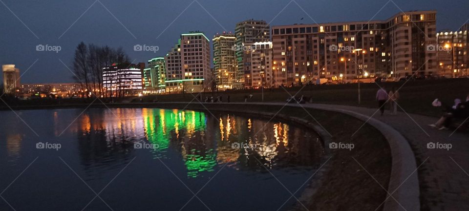 beautiful night light street view, windows magic light, cityscape and reflection in water