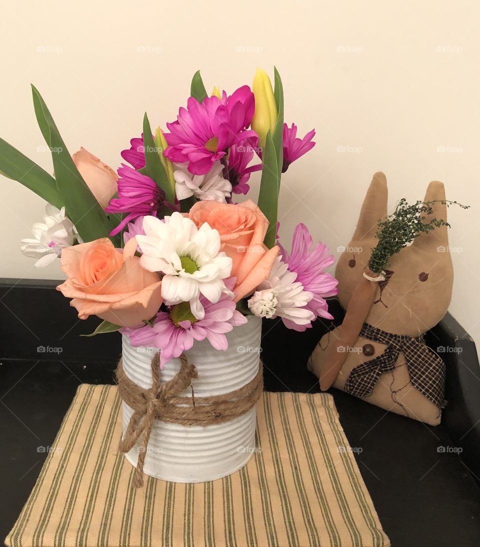 Fresh flowers in a tin can 