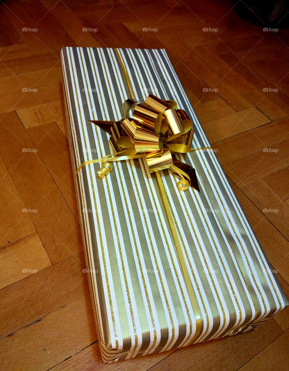 Present with golden ribbon