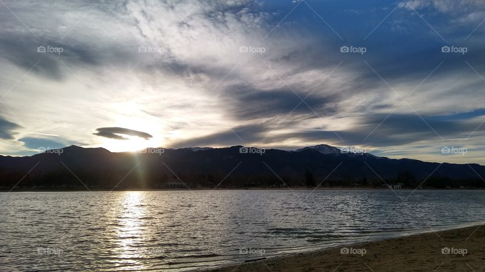 mountain city sunset at the lake