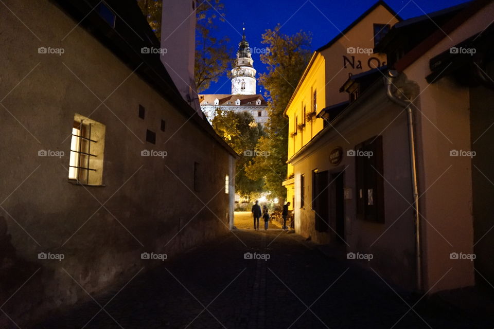 Night shot of father and son on the street in Cesky Krumlov ...