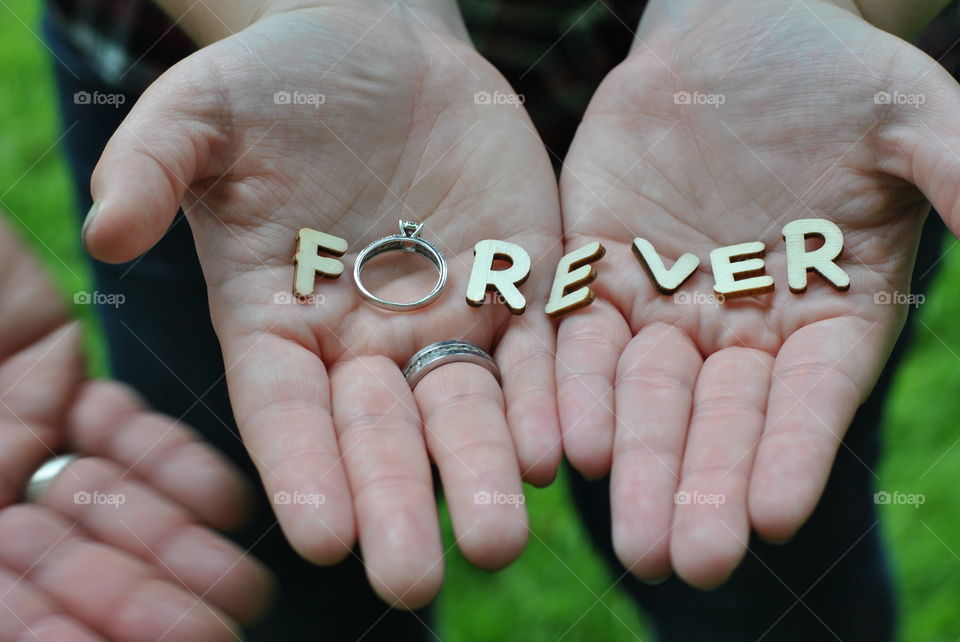 Forever text with ring on hand