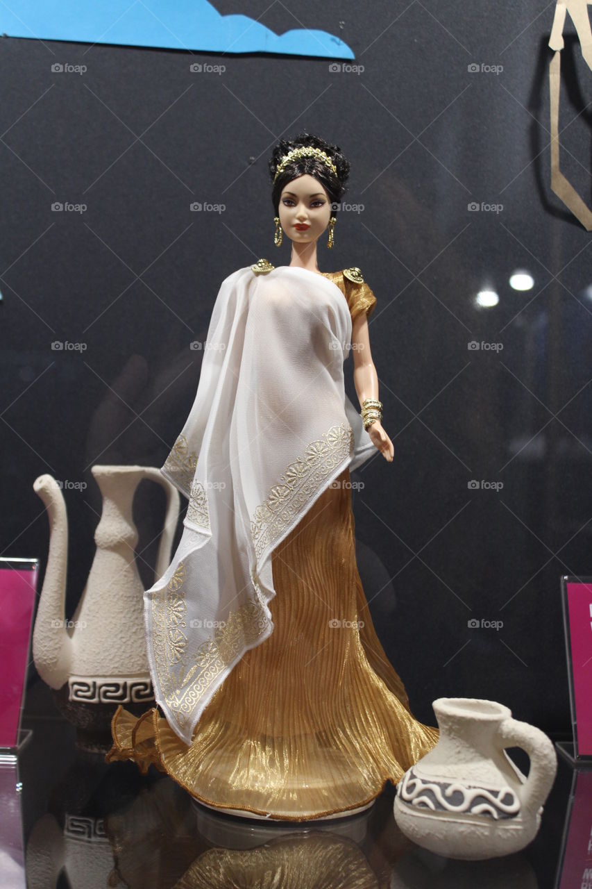 Barbie in the costume of the Greek goddess. the Empress. Exhibition. Barbie