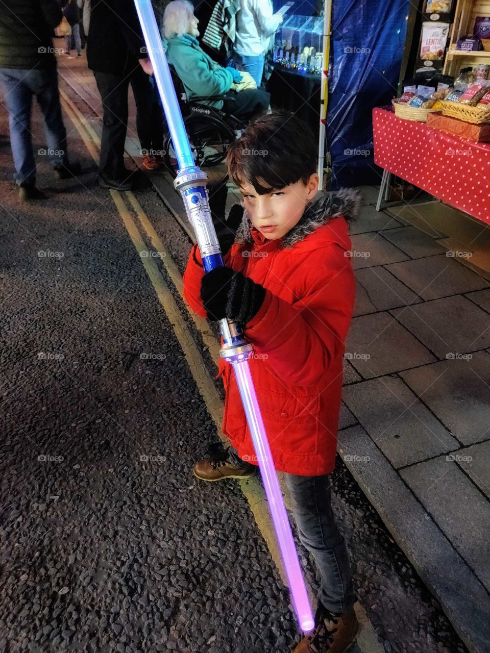 Little boy..very serious about his light sabre