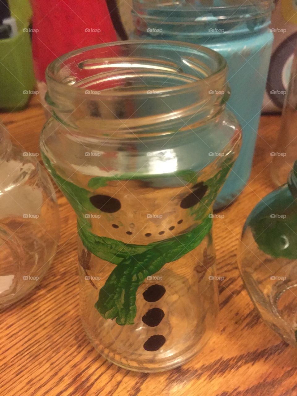 Snowman painted bottle jar