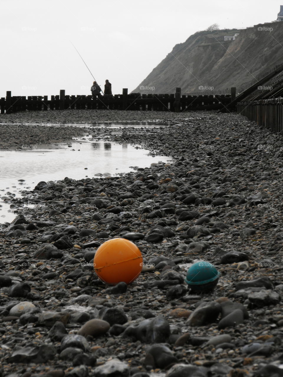 A couple of fishermen, beach, cliff