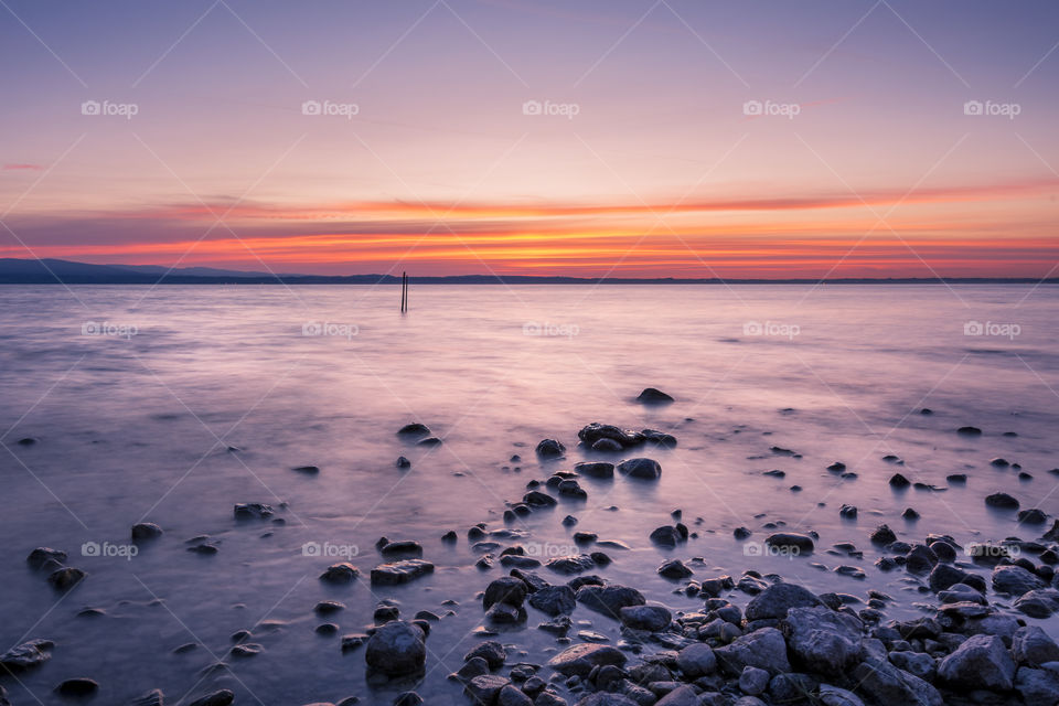 Sunrise into the lake Garda.