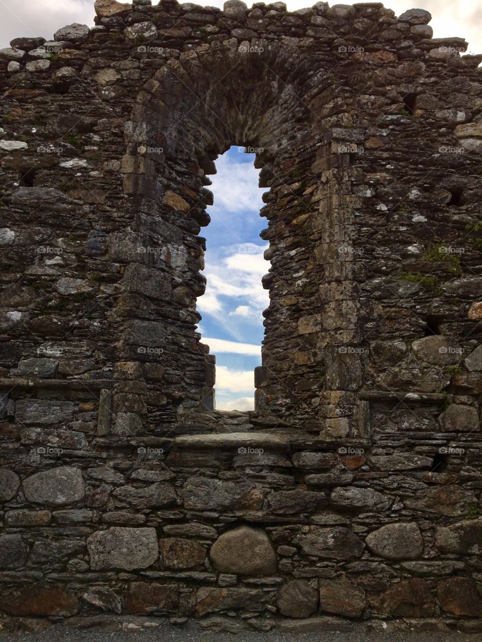 Sky view through castle slit window