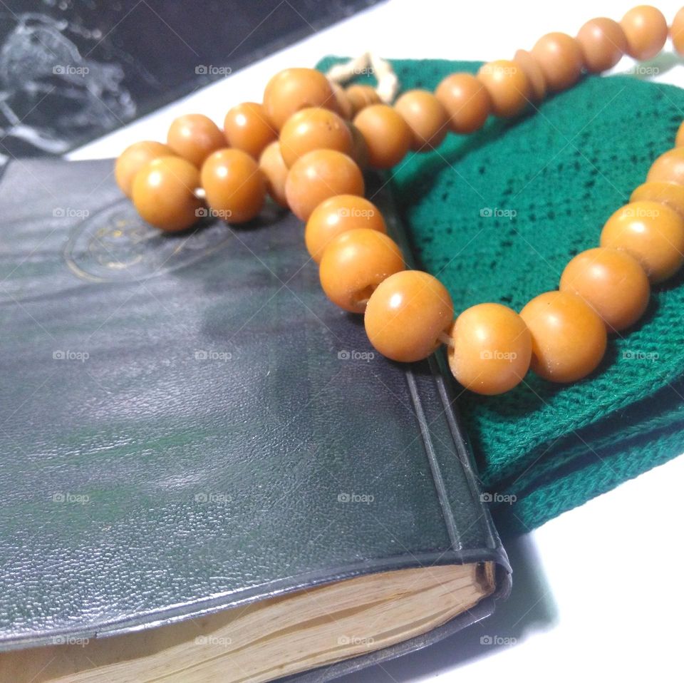 Prayer bead on green cap