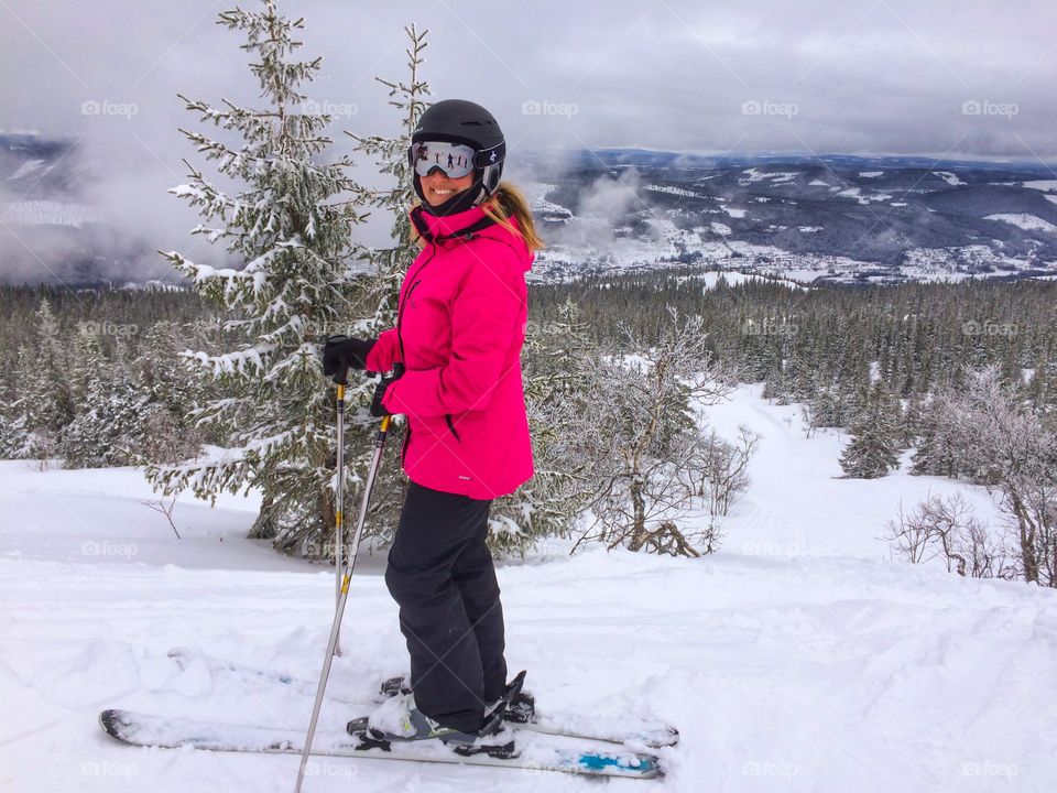 Happy woman skiing in snow