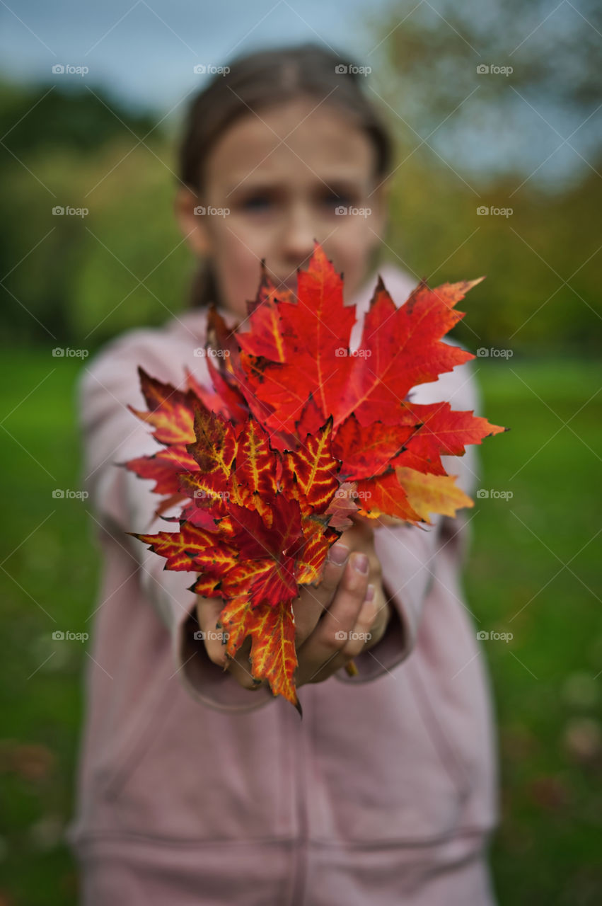Girl with autumn bouquet.