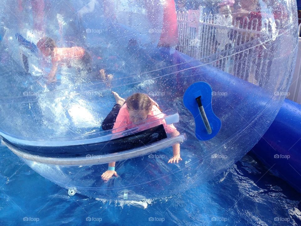 Inside bubble on water. Amusement ride state fair