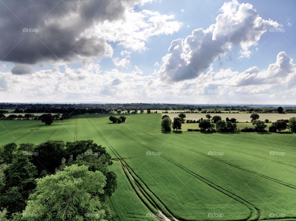 European countryside. Dramatic sky, coupled with beautiful green fields. 