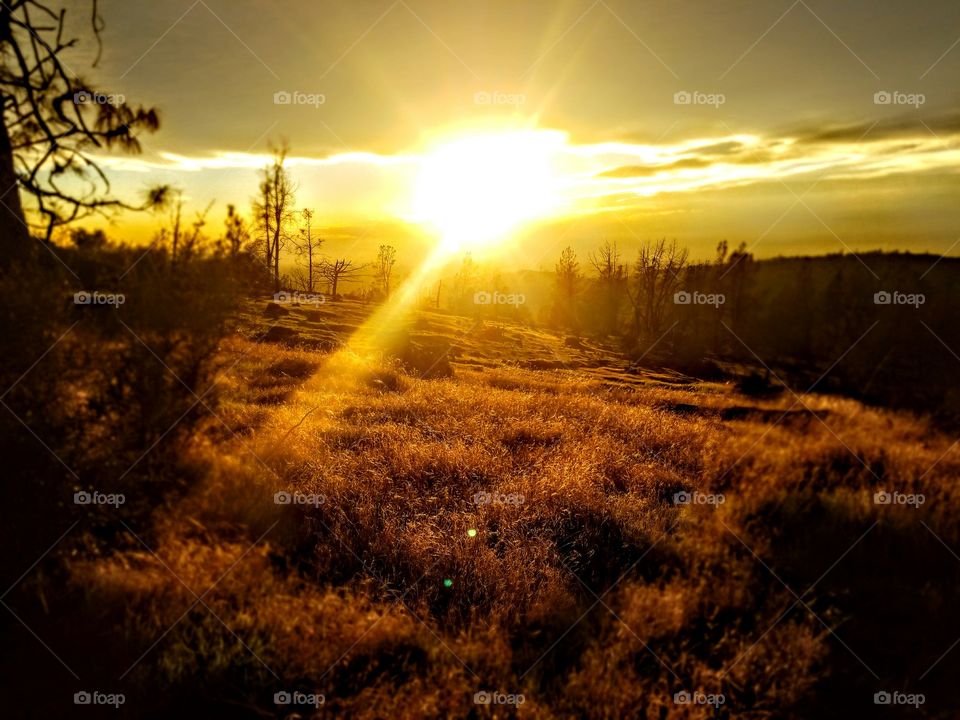 Scenic view of sunset over mountains
