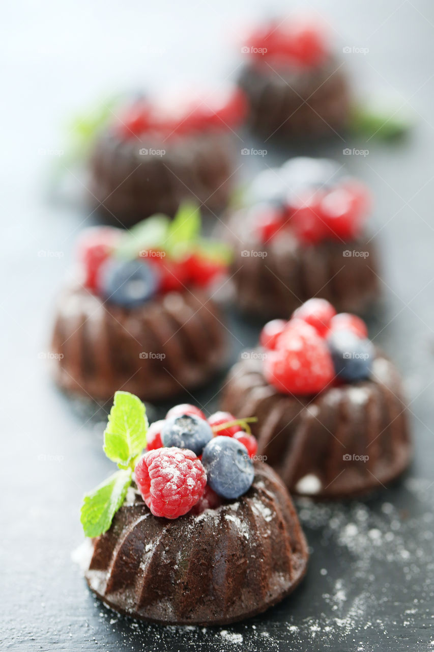 Homemade chocolate muffin with berries