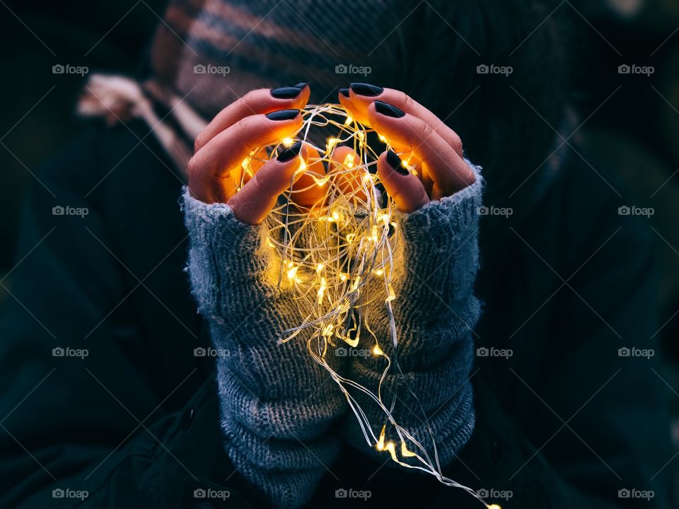 Woman holding a illuminated light