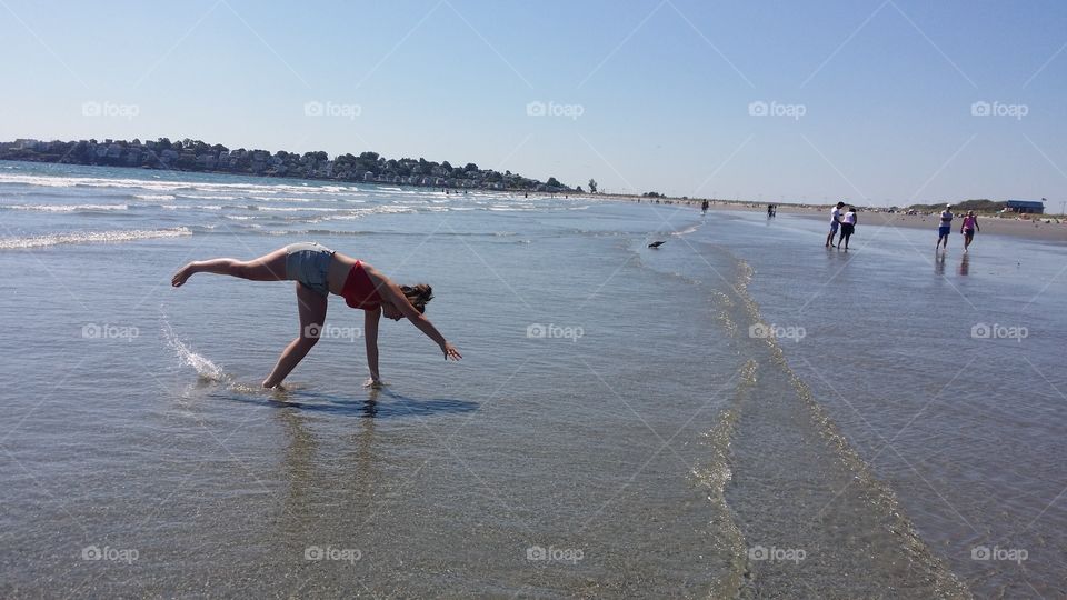 cartwheels in the sand