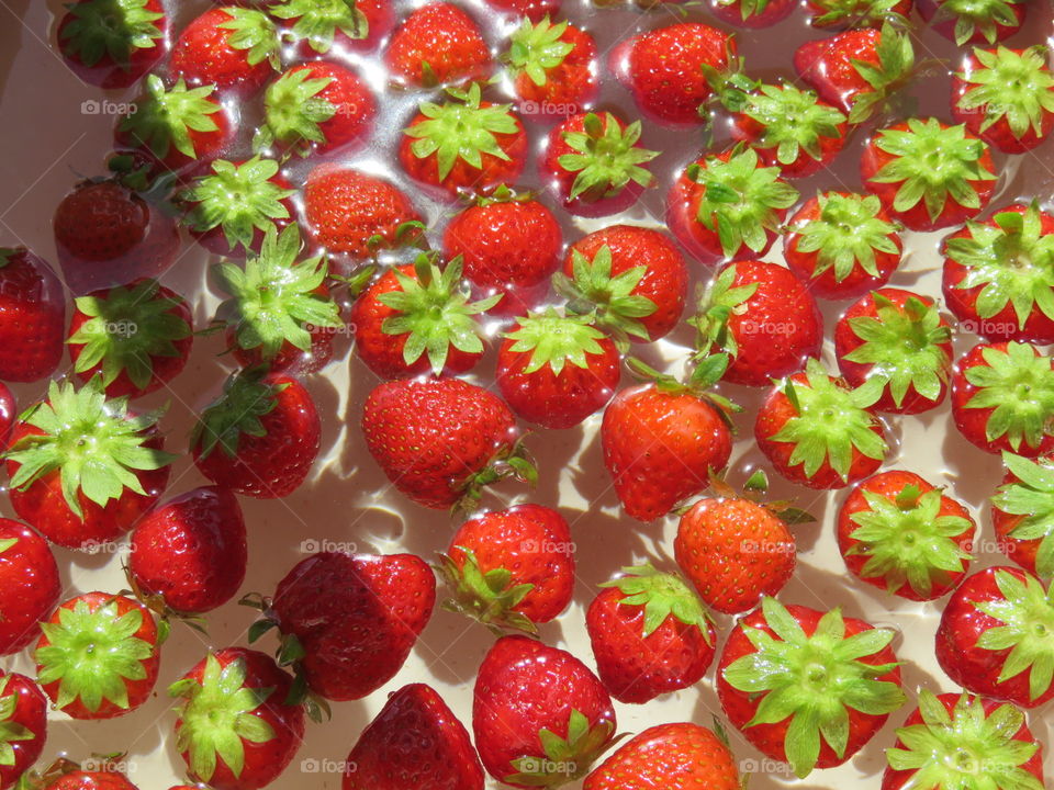 washing strawberries