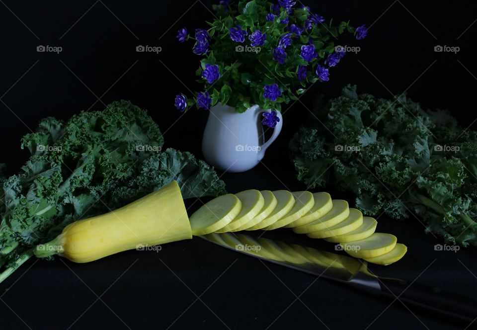 Sliced Yellow Squash, Leafy Lettuces, Knife and Flowers