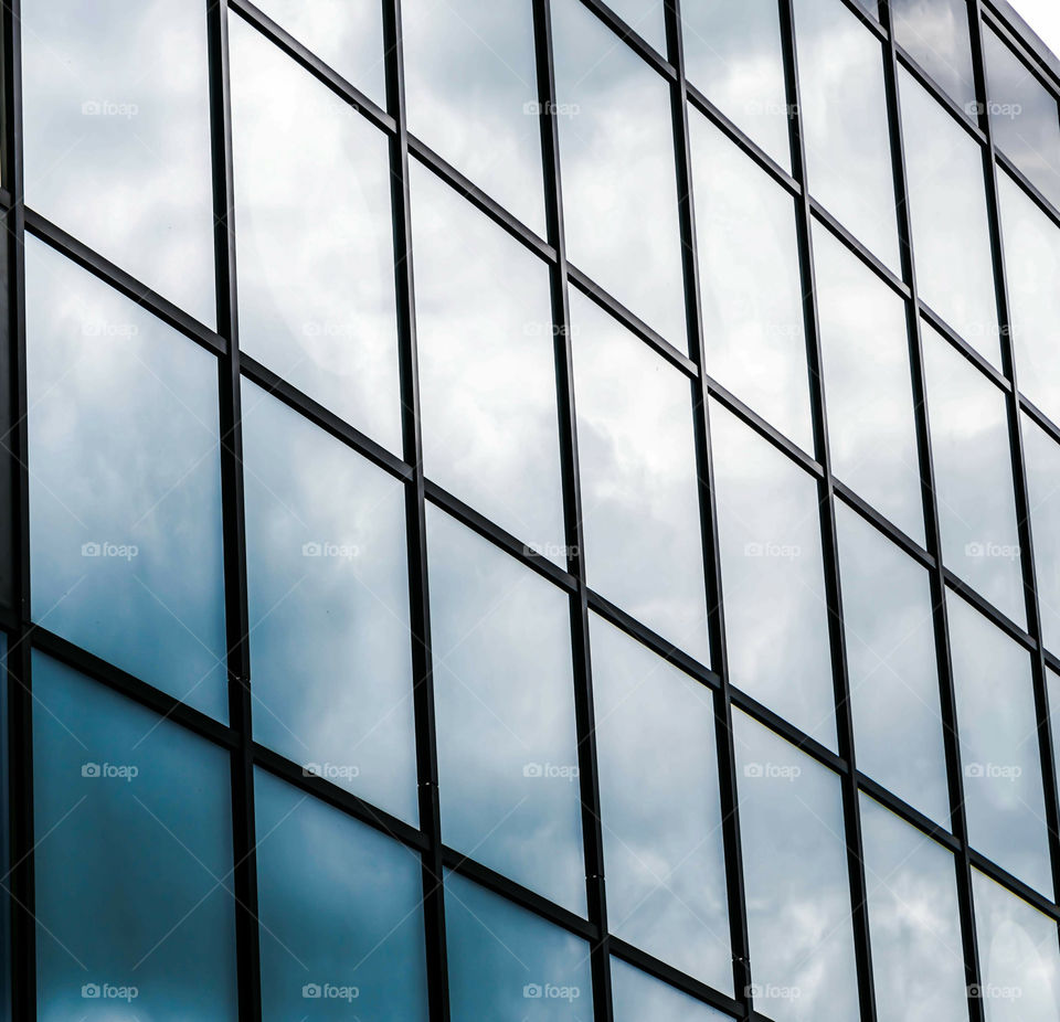 Skyscraper Square Window Panels Reflecting The Clouds