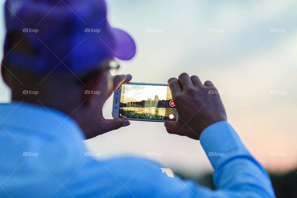 Man taking photo with mobile phone 