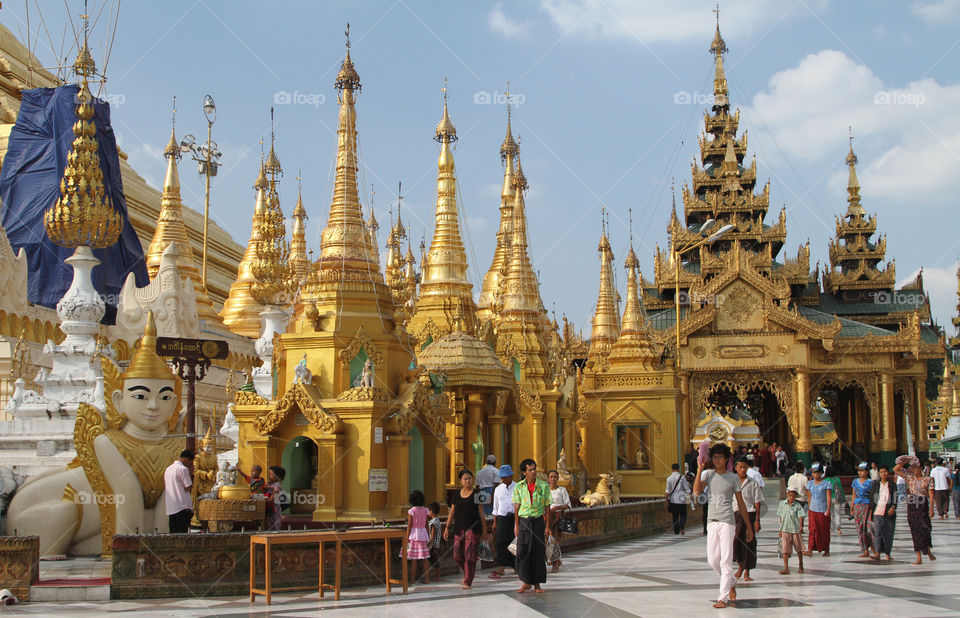 Visitors walk through the Shwedagon pagoda complex in Yangon, Myanmar