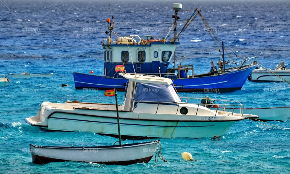 colorful fishing boats in punta de mujeres on lanzarote canary island in spain