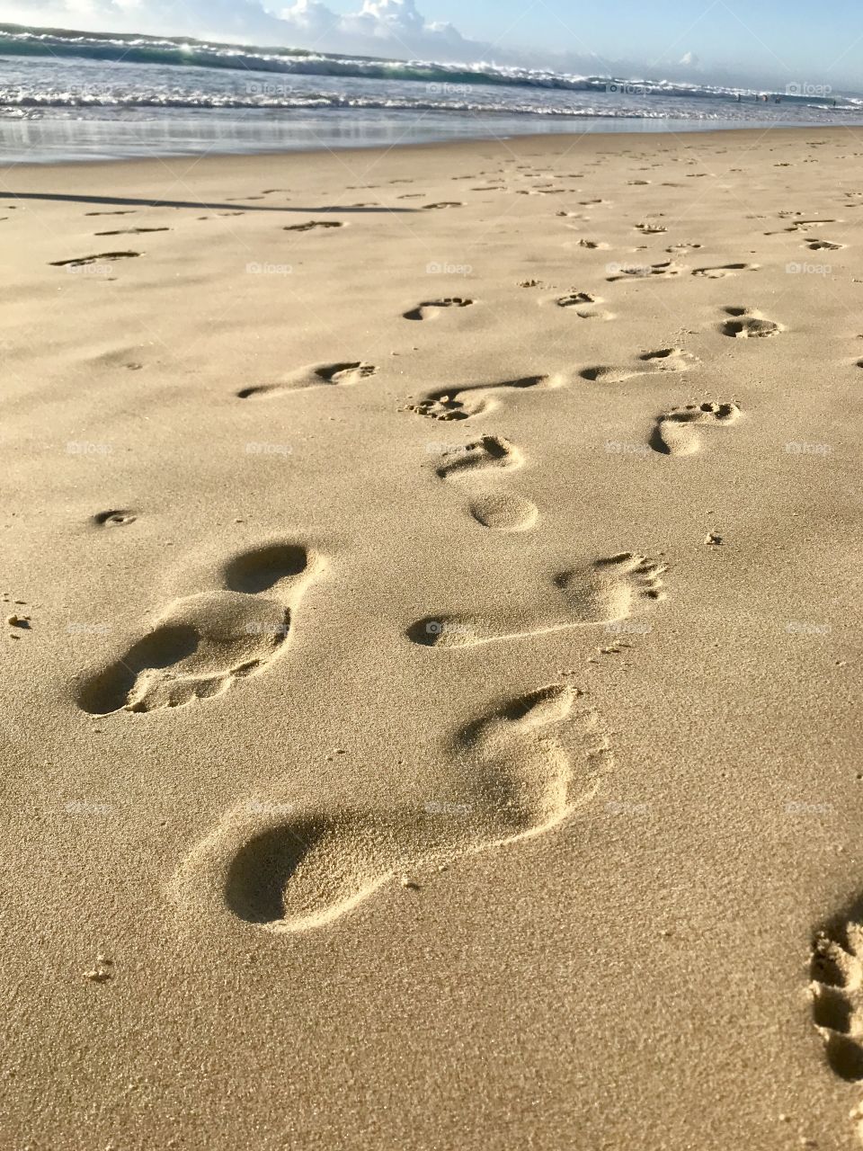 Footprints on the sand on the beach at Surfers Paradise Gold Coast Australia