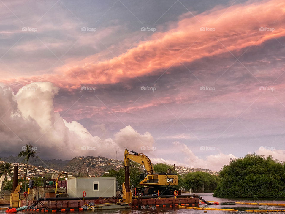 Dredging platform on the Ala Wai Canal in Honolulu, Hawaii at sunset