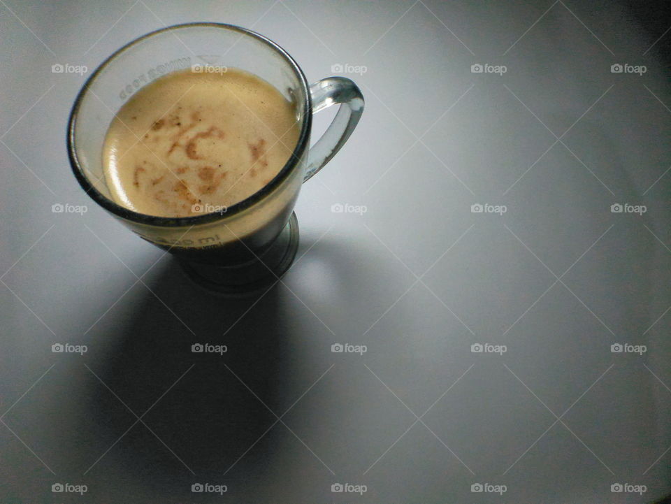A cup of homemade cappucino in low light accompanied me late at night, away from prestige and a luxurious lifestyle. I am proud to feel this simplicity