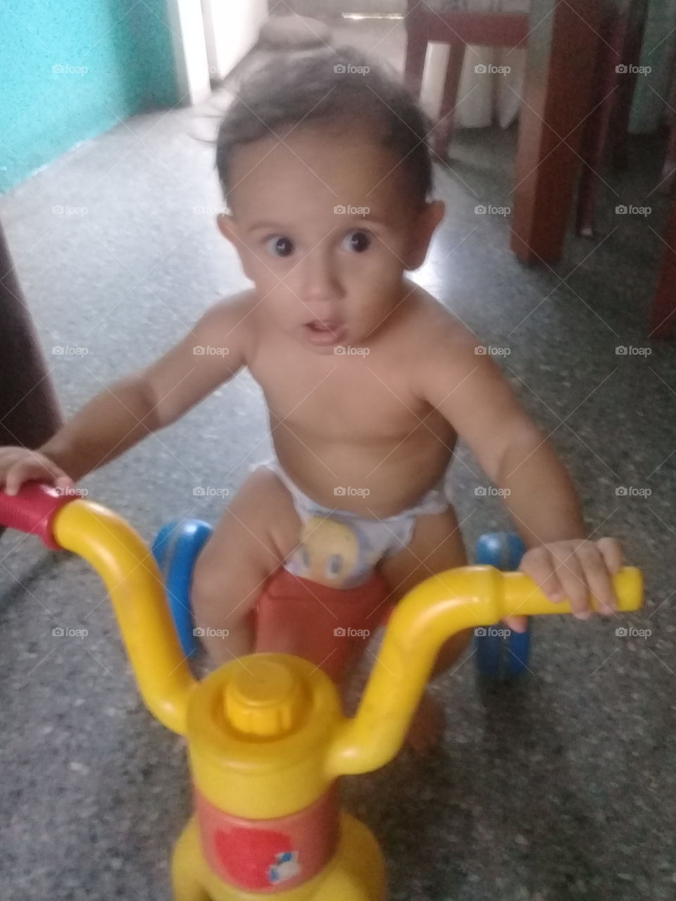 baby riding tricycle