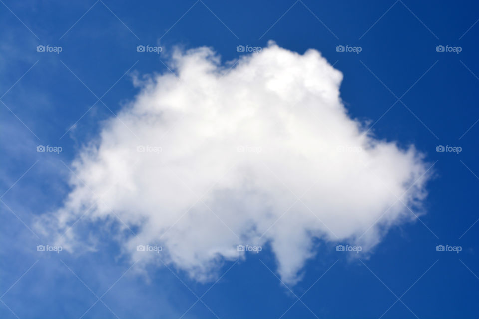 White cloud against blue sky background