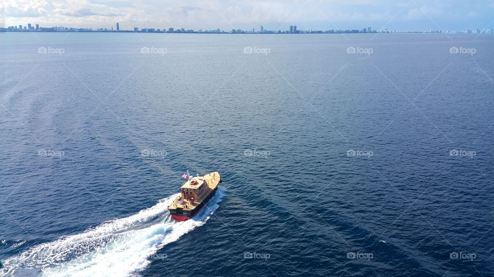 Pilot boat all finished and is headed back to Miami.. You can also see the whole Florida coastline