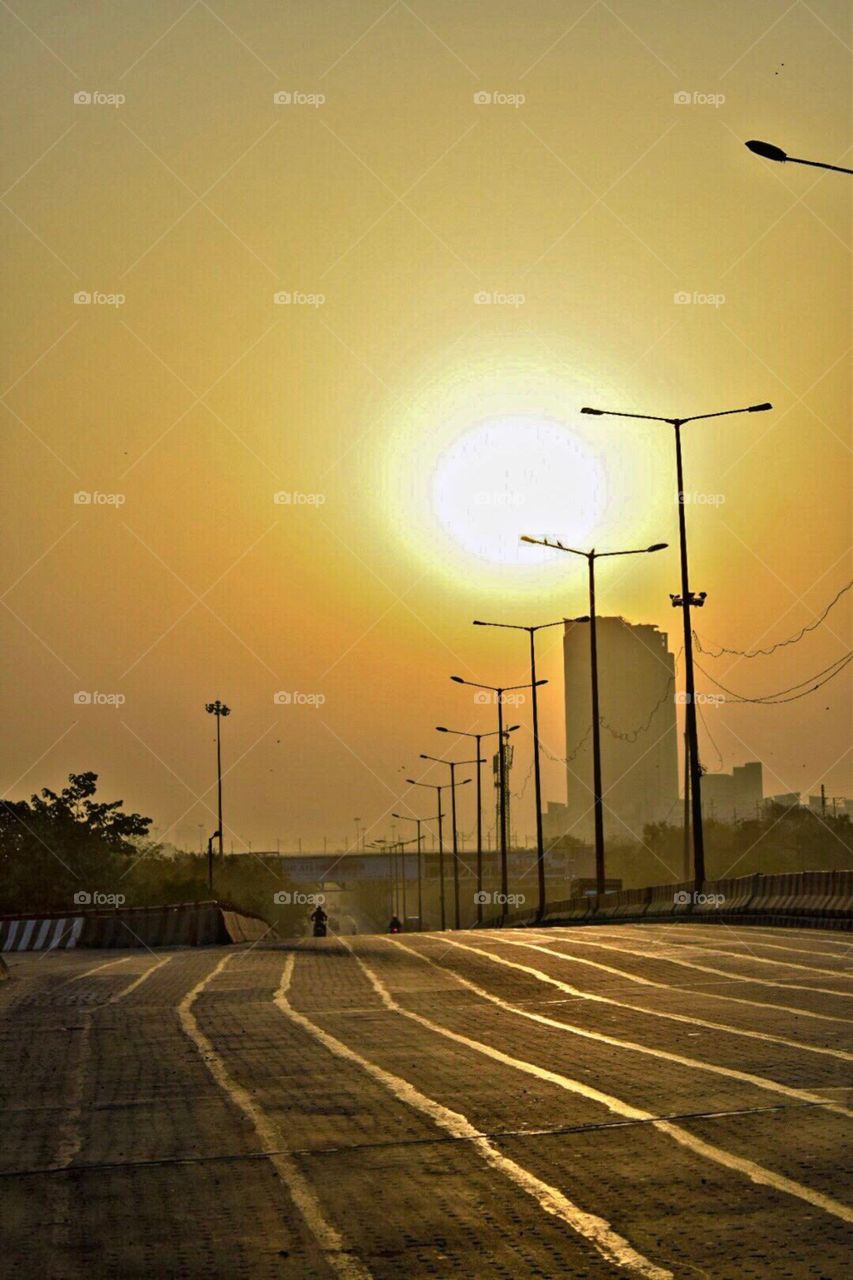 Sun Set , empty road , city life