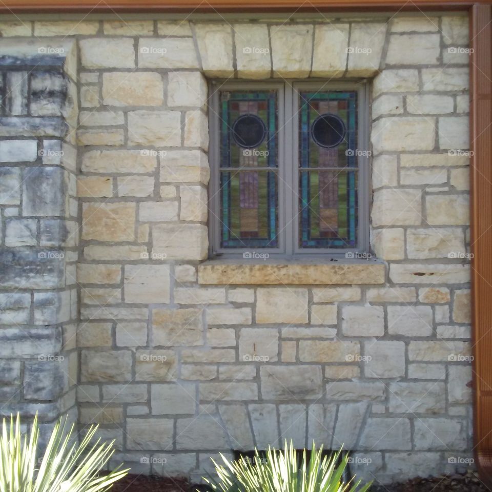 church window in stone wall