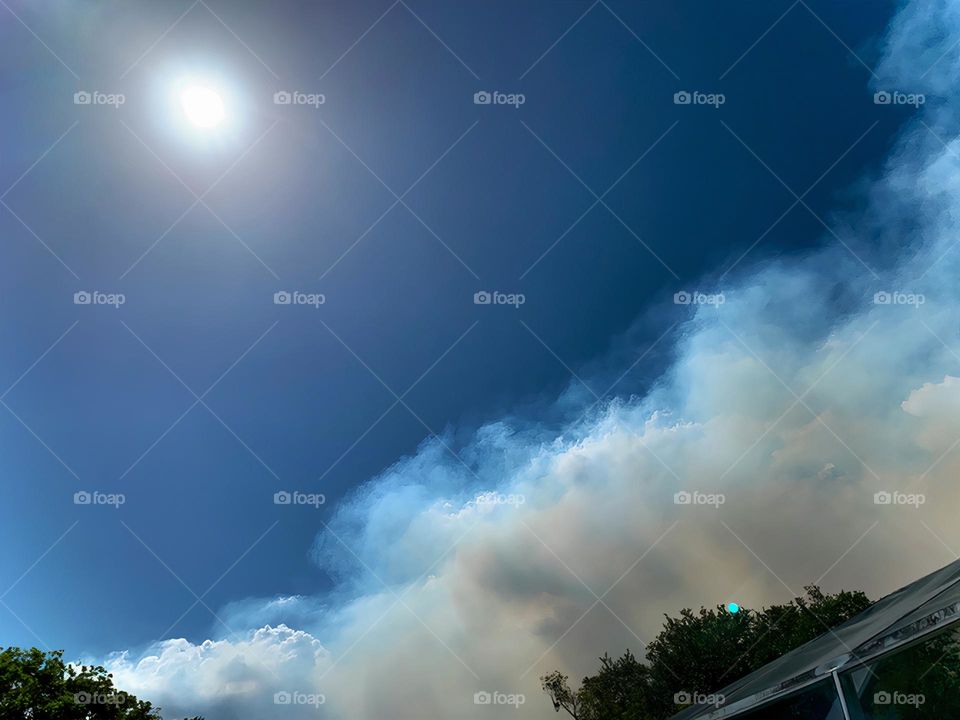 Control Burn Fire Cloud Spread Covering Blue Sunny Sky