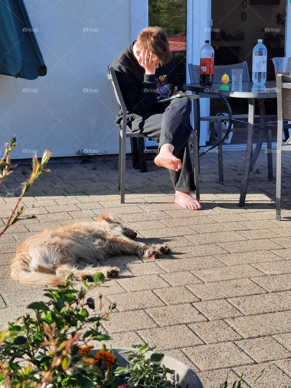 boy with tablet and a dog