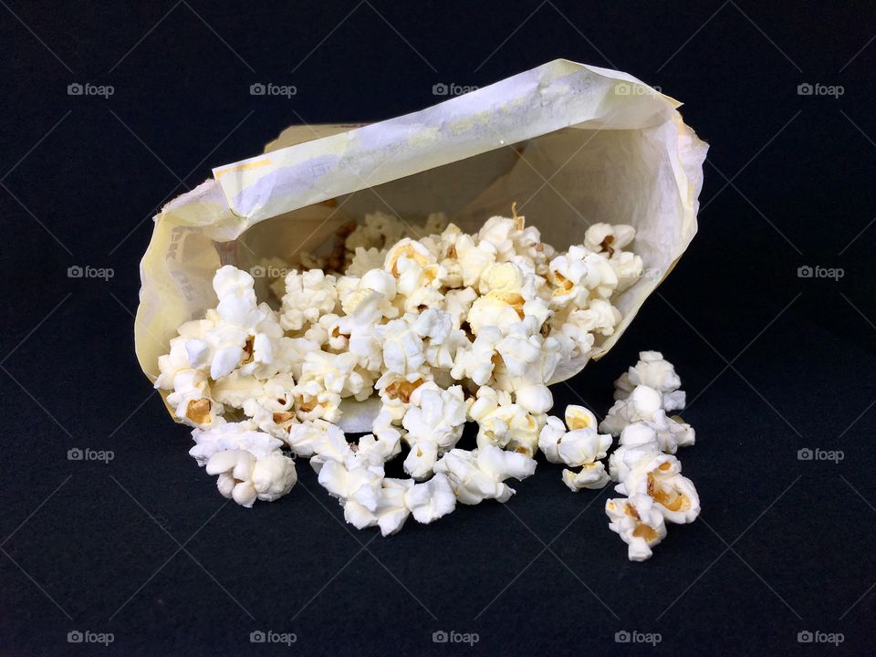 Popcorn spilling out of bag. 