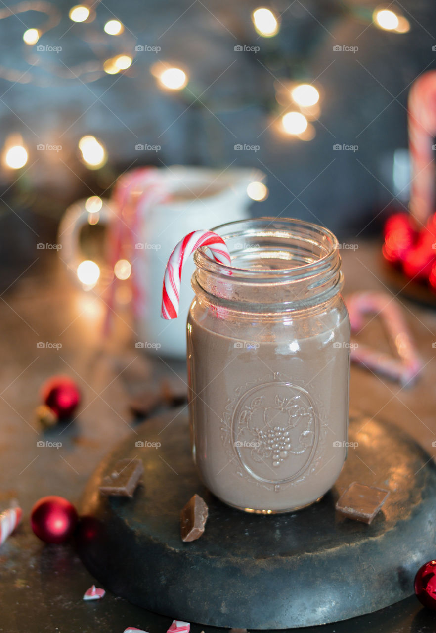 Hot chocolate drink for the Christmas time, holidays season, best photo 2019, food photography in 2019 , cozy ambiance, snuggle in a cozy bed with jar of hot chocolate 