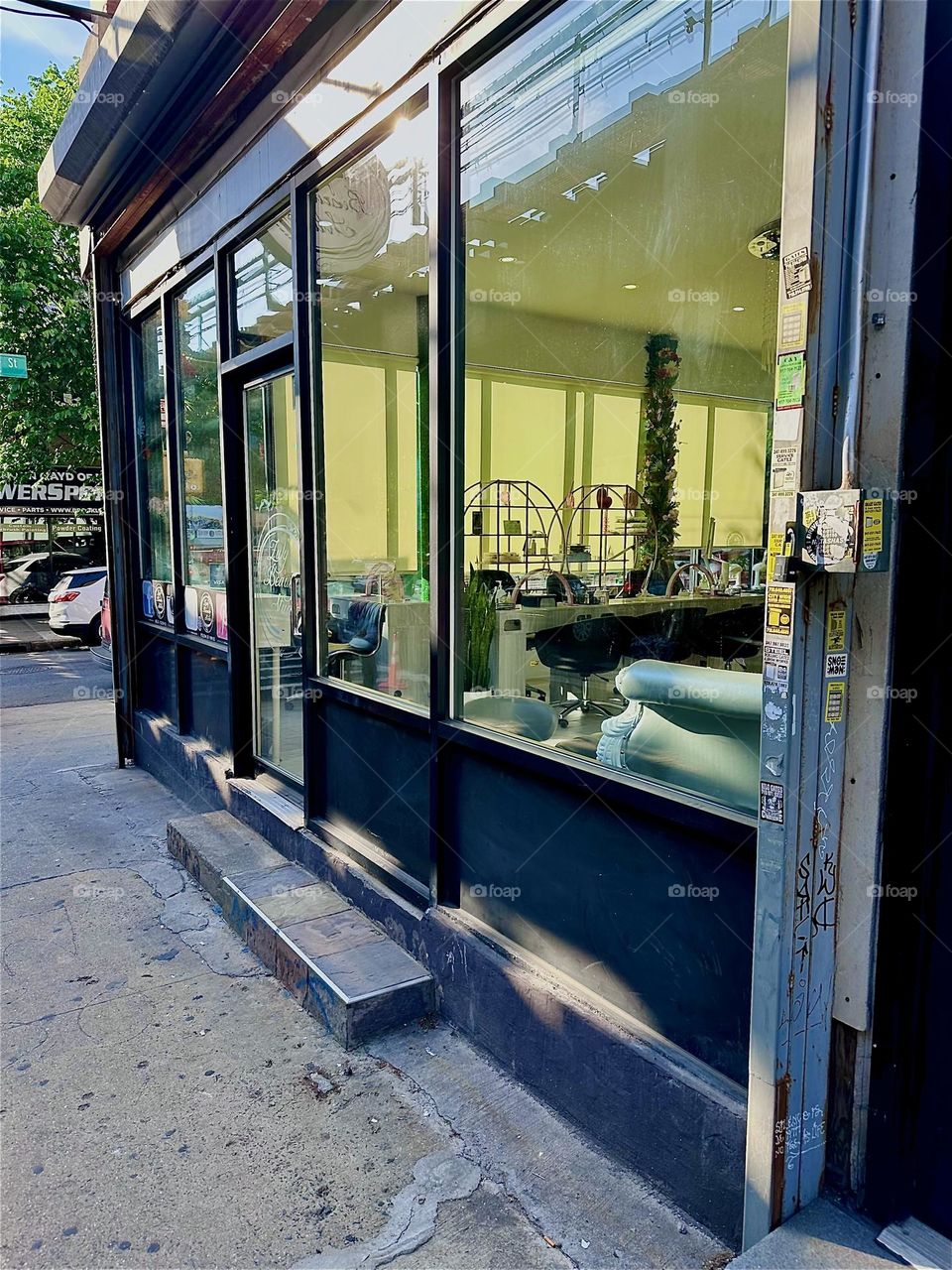 This is a storefront on “Broadway” in “Bushwick”, Brooklyn, NY in the vicinity of “Flushing Avenue” and “Woodhull Hospital”. 2024. Hypnotic Productions